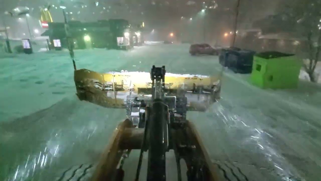 Snow plowing of a big commercial outlet in 9