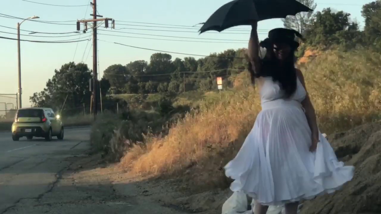 Super windy day with umbrella in LA with my Monroe pleated dress!