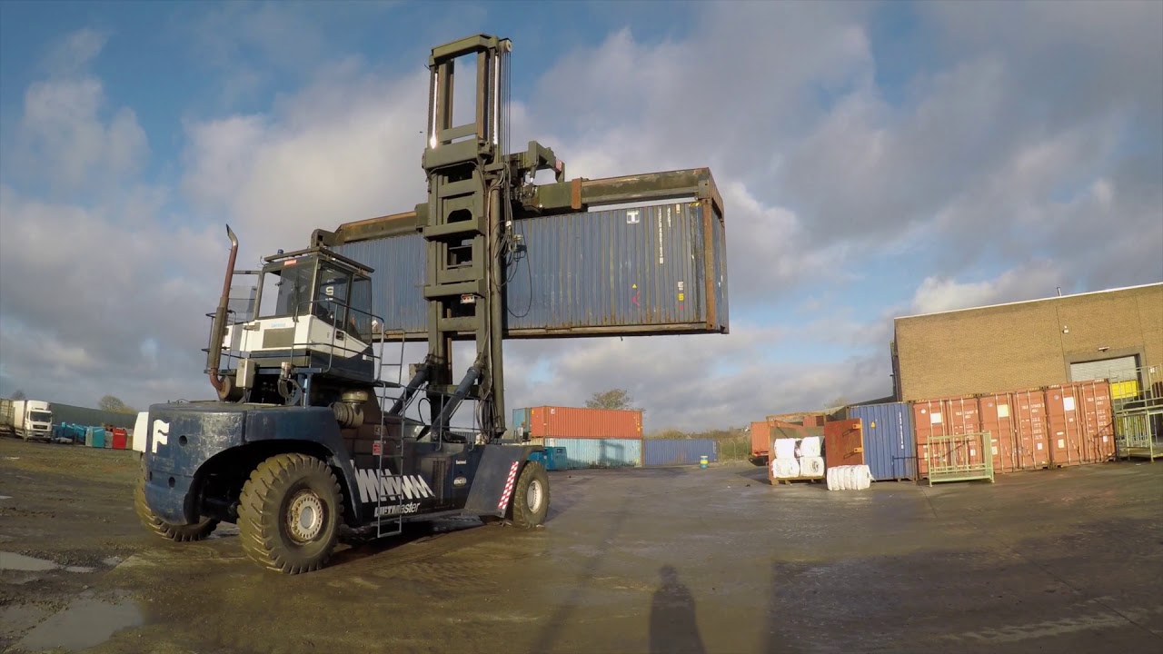 Terex Fantuzzi shipping container handler stacking boxes at Alltex Recyclers Ltd, County Antrim.
