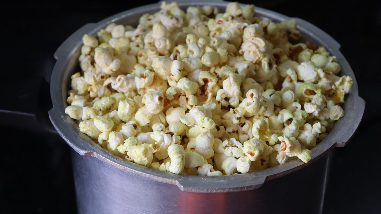 How to make popcorn in a cooker/Popcorn Recipe at Home in Malayalam/Homemade Popcorn in Cooker