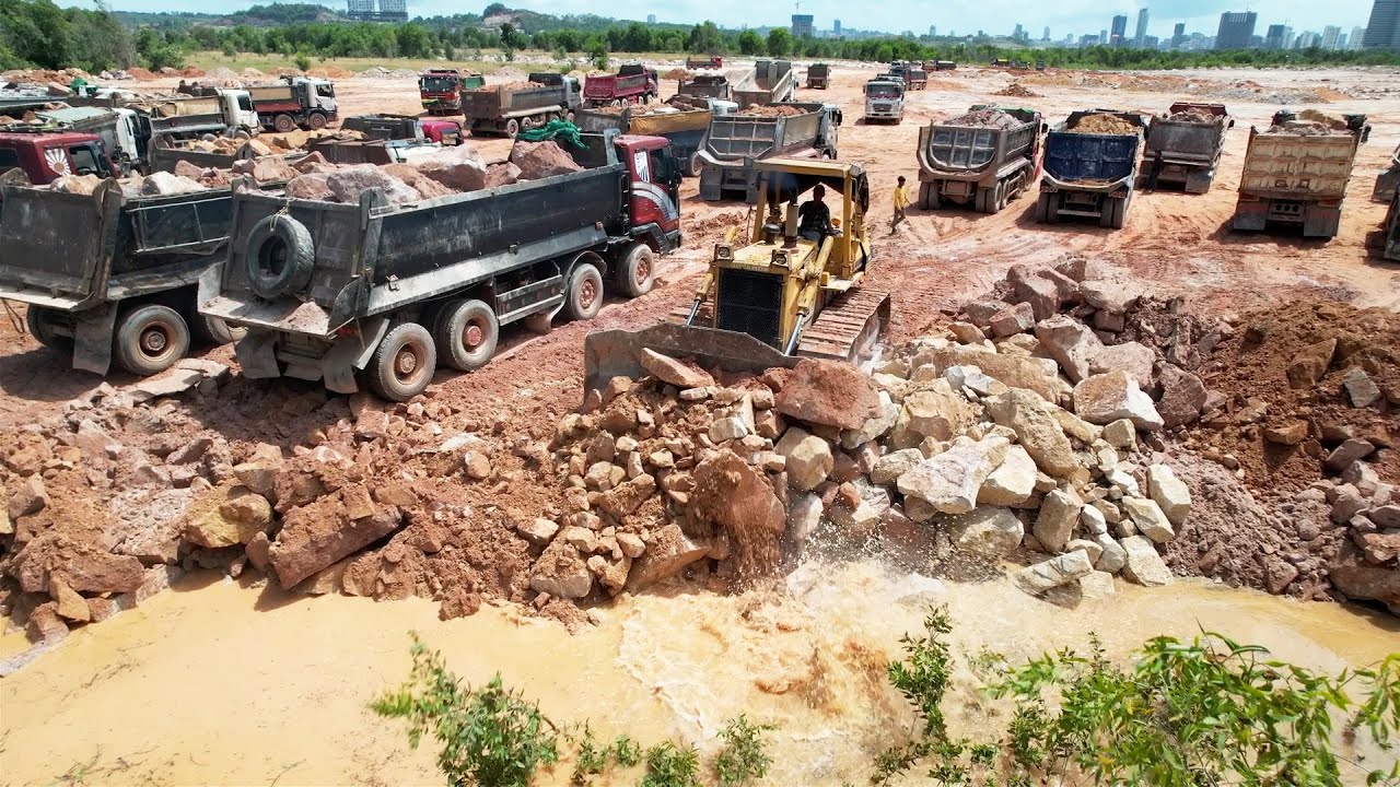 Good Activities Huge Land Reclamation Strong Bulldozer Working, Many Dump Trucks Transport Stones