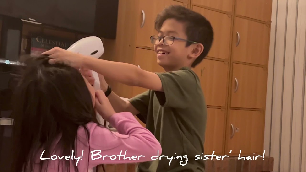 Lovely! Brother is drying his sister’s hair :)