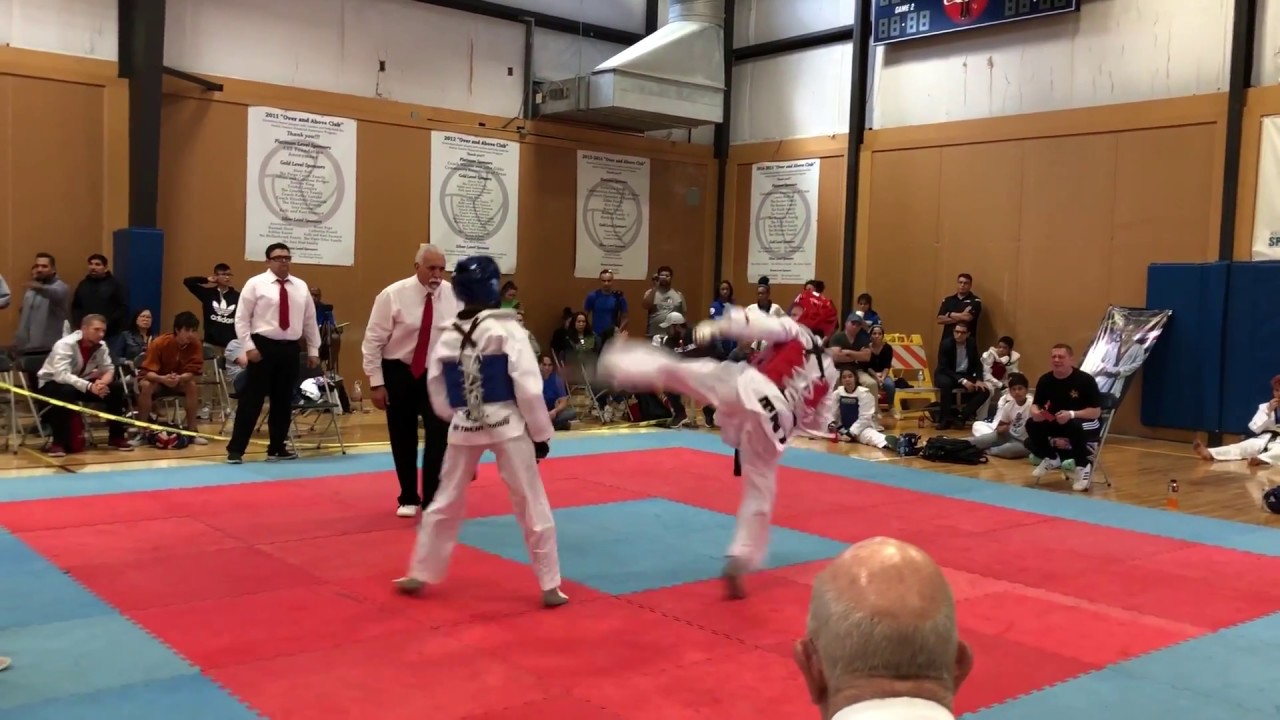 Taekwondo Varsity Tournament - Khang Ho - Fight One 5-14 Blue