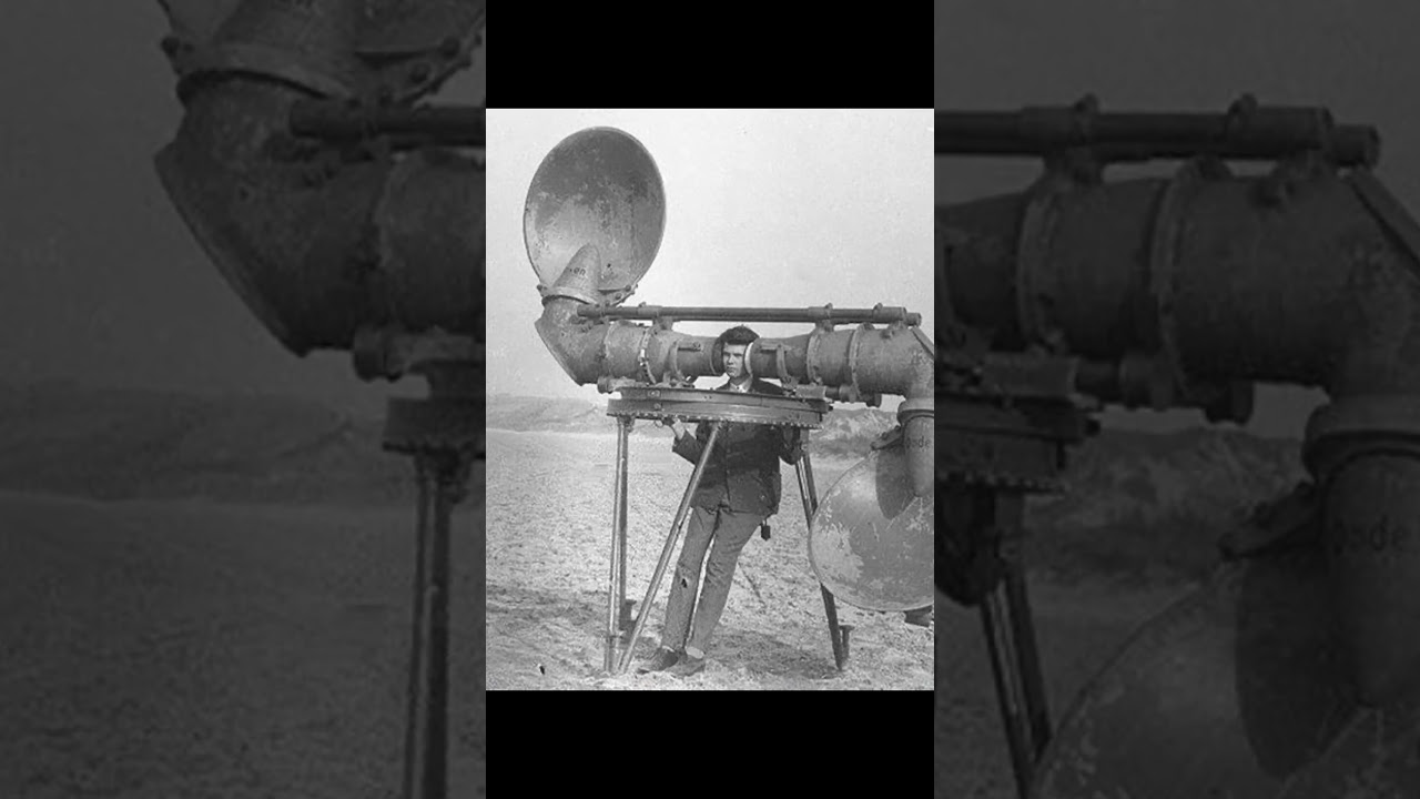 Radar man is using an acoustic device to detect the sound of the engines of incoming enemy aircraft