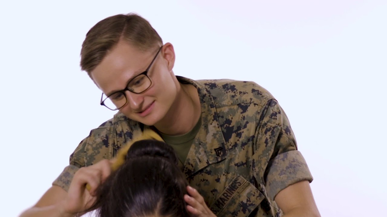 Male Marines attempt to form sock buns