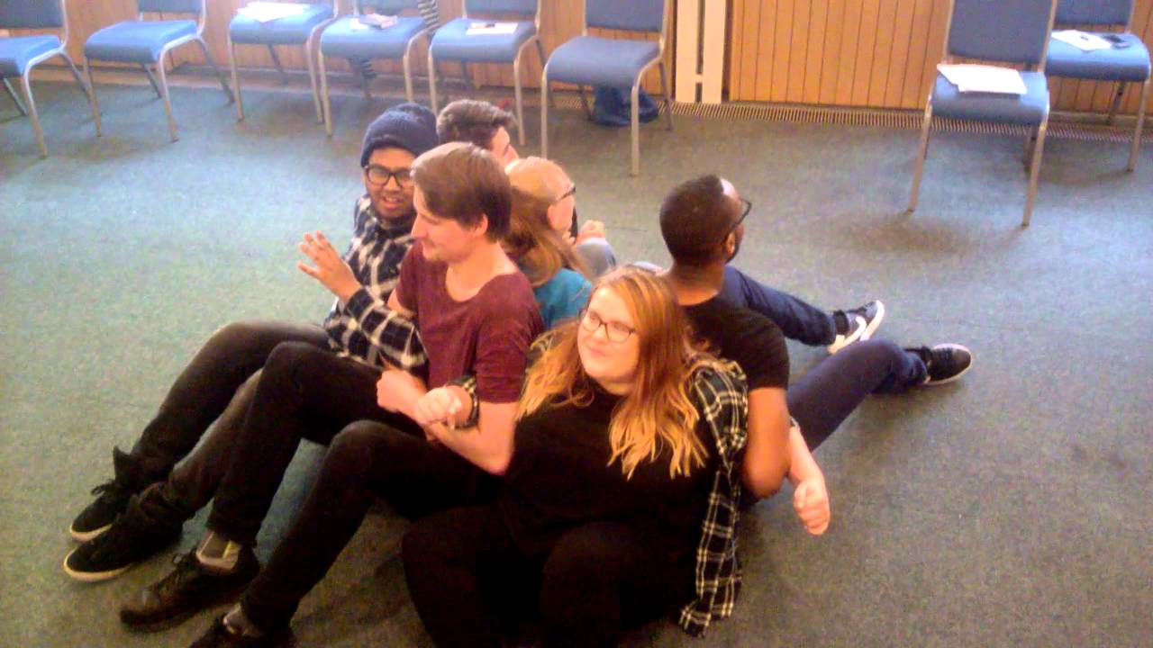 Standing up with linked arms: Teamwork challenge