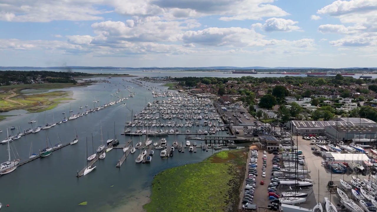 4K aerial view of the Hamble River in Hampshire, showing yachts moored in July 2025.