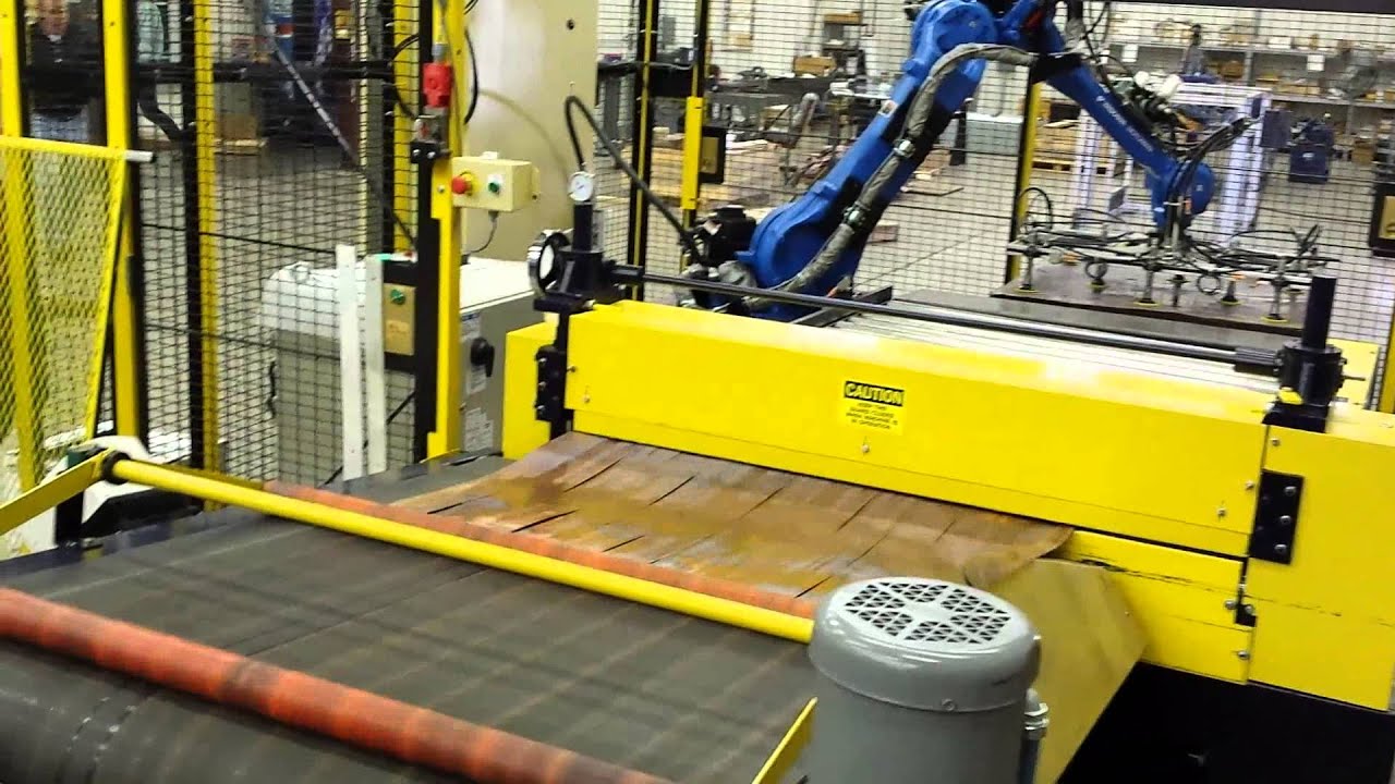 Robot feeding a sheet slitter