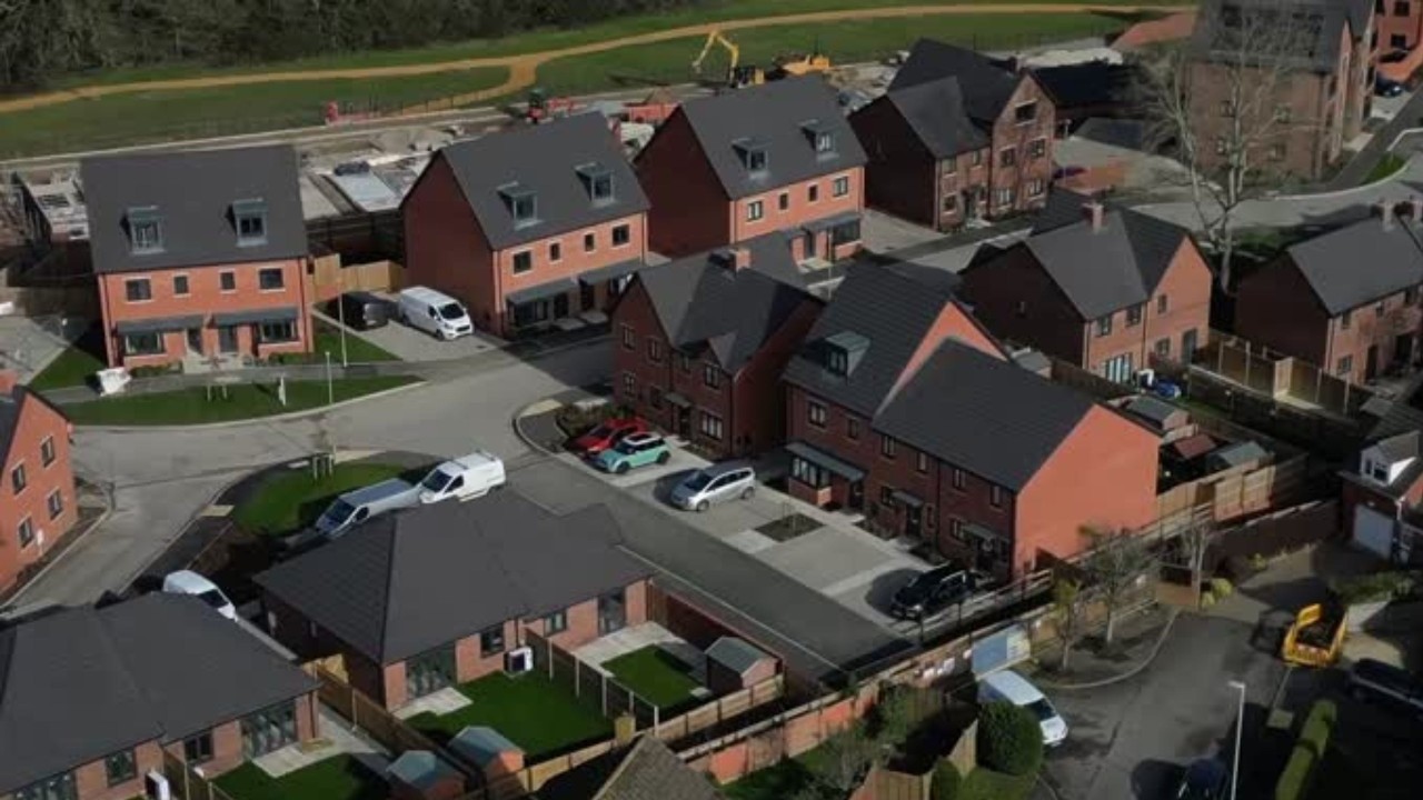 Man hires £150 a day security to guard small wall in row with developers | SWNS