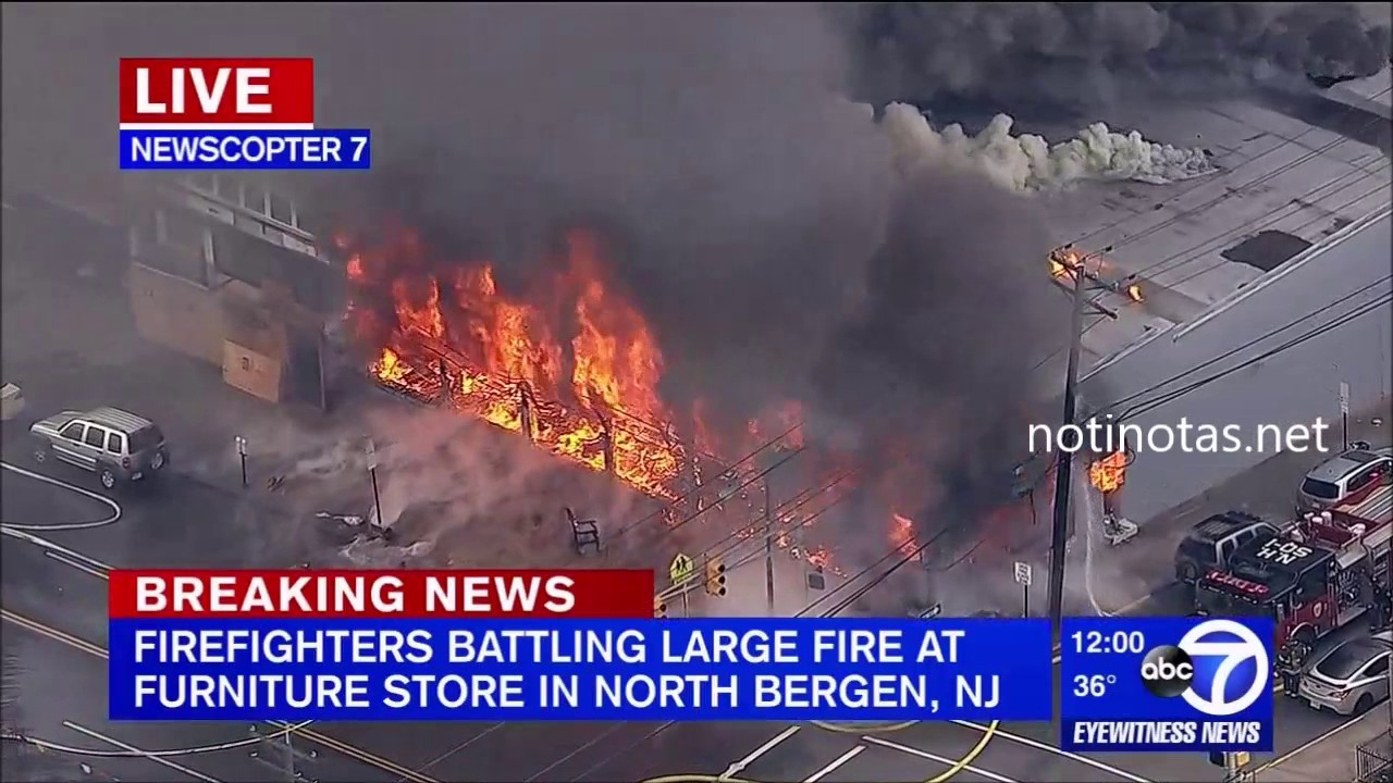 MASSIVE FIRE BURNING THROUGH ROOF OF FURNITURE STORE IN NORTH BERGEN, NEW JERSEY