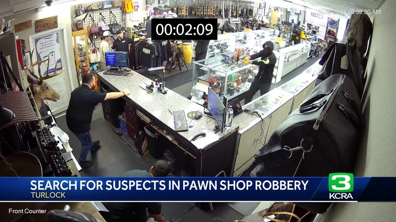 Surveillance video shows employees held at gunpoint in Turlock pawn shop robbery