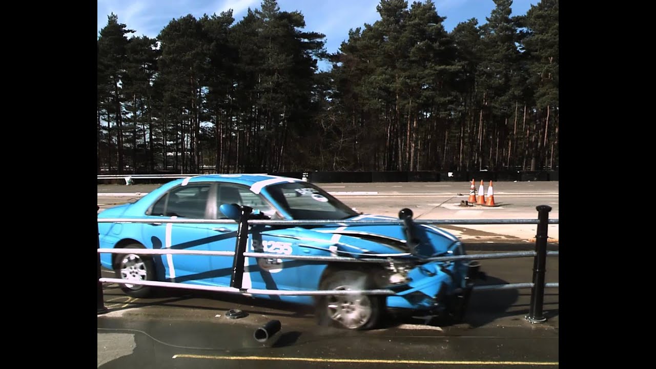 Car Crashes into Metal Fence in Slow Motion