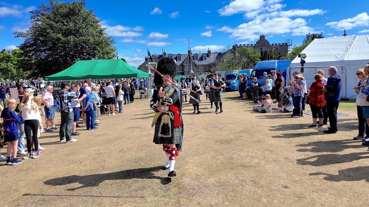 Drum Major leads Ellon RBL Pipe Band march into the 2025 Aboyne Highland Games in Deeside, Scotland