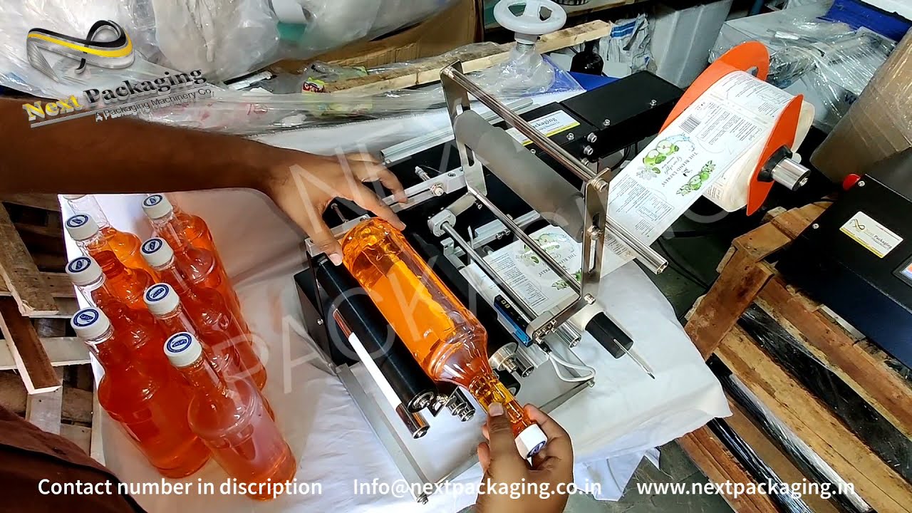 Sticker labelling machine for syrup bottles | Economy wraparound adhesive label applicator for round