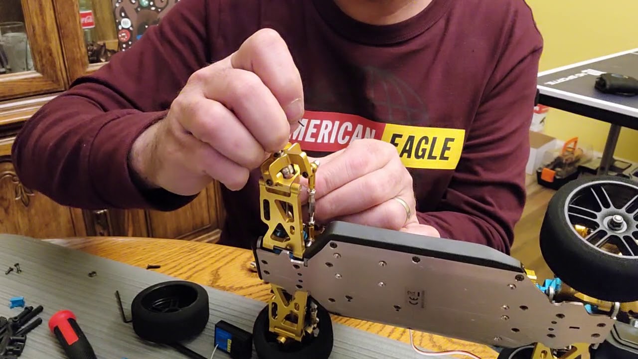 WLTOYS 144001 front wheel wiggle fix (shim version)