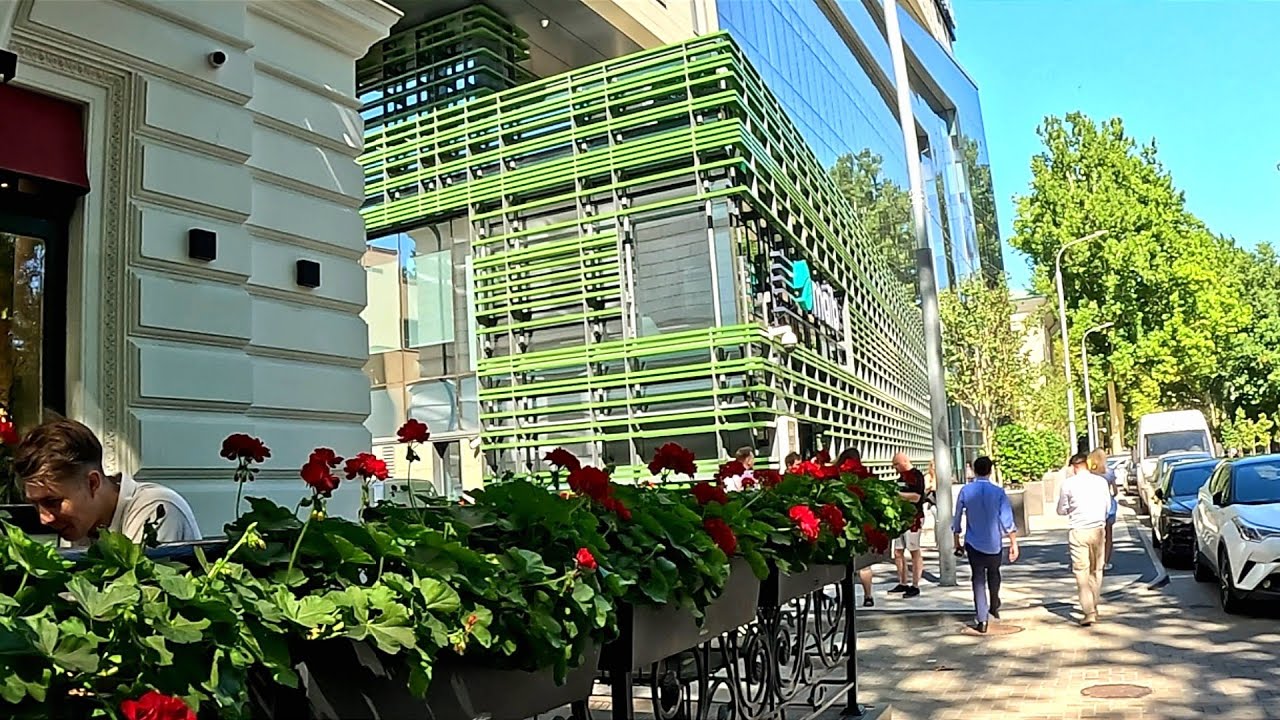 Central streets Chisinau Moldova. Life Moldova. Modern buildings Chisinau. Trees on streets Chisinau