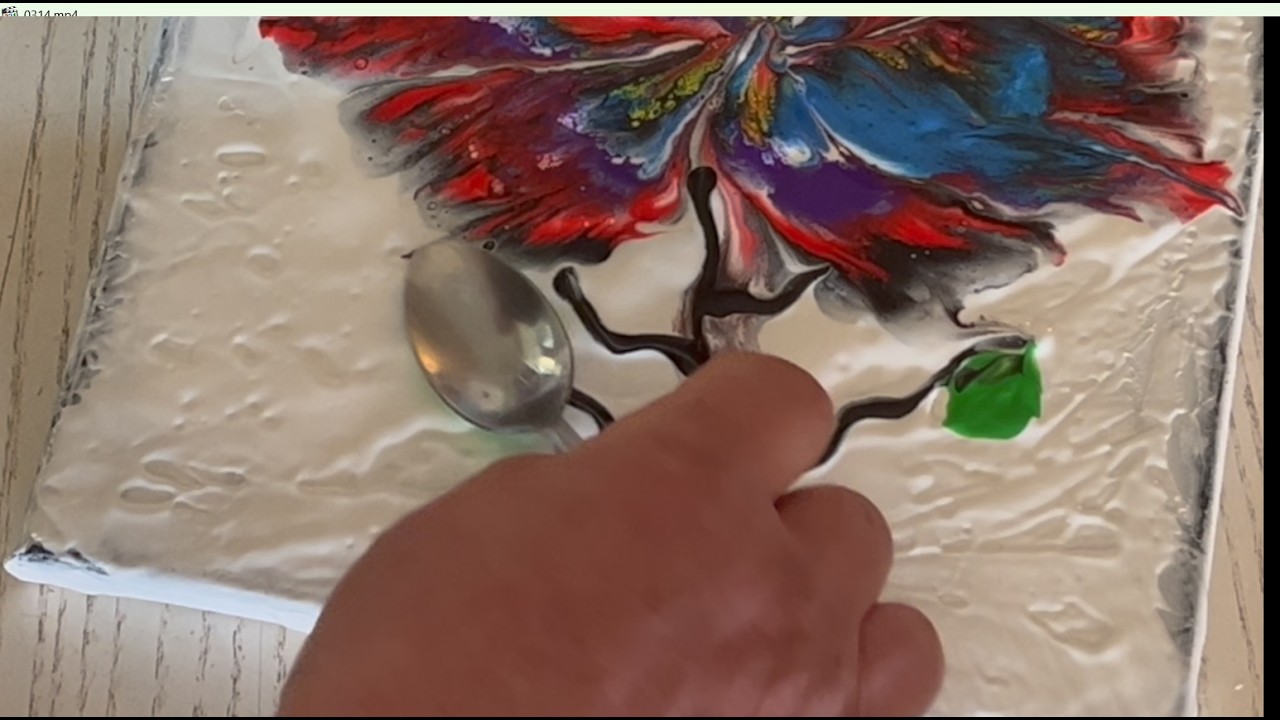 Flower with plastic wrap and a spoon. Acrylic pouring painting.