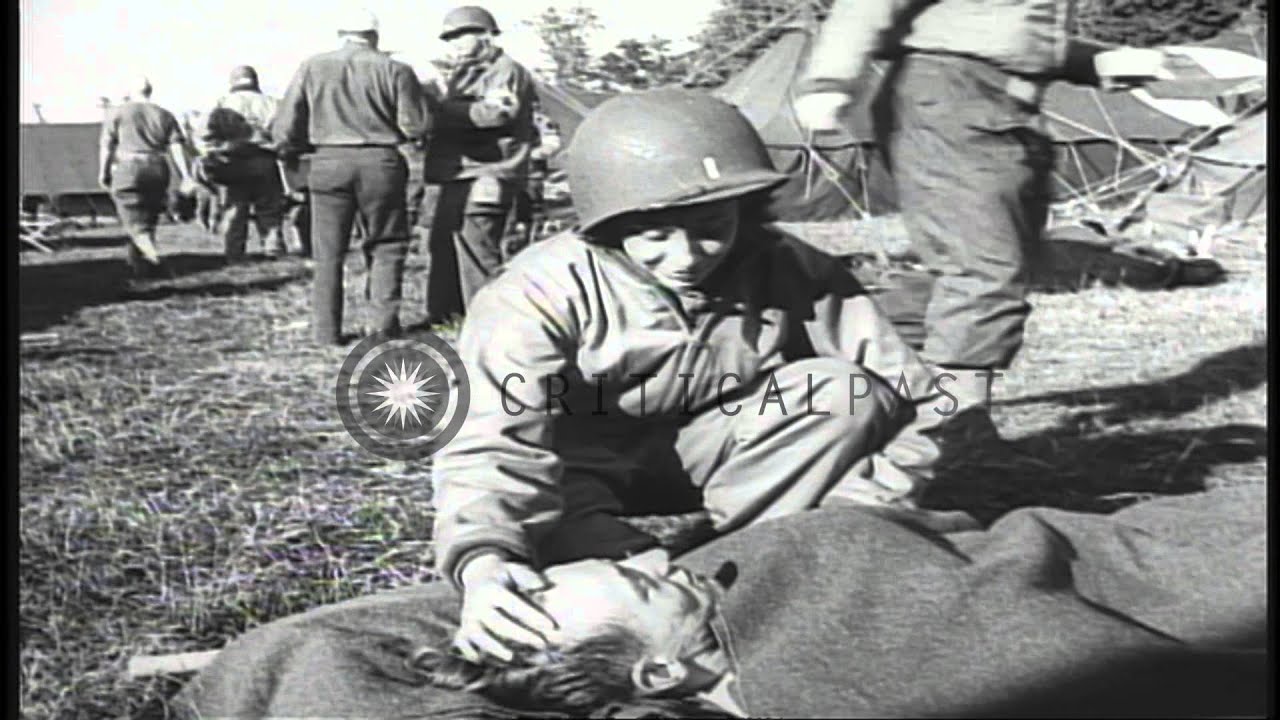 Wounded US soldiers being brought at a field hospital after Allied invasion of No...HD Stock Footage