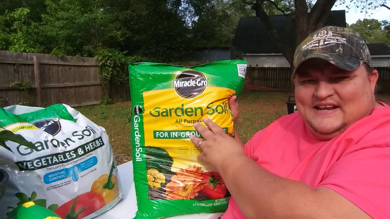 Planting with Miracle Grow potting soil and compost.