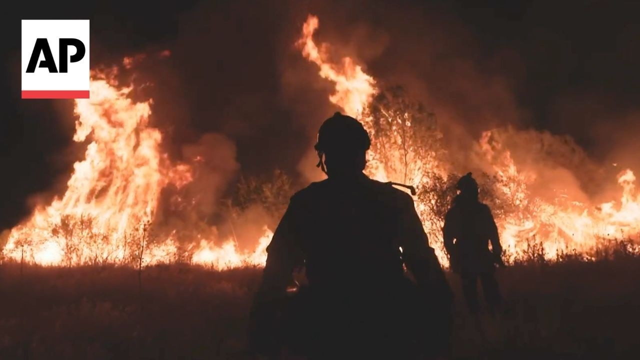 Spain firefighters battle to contain wildfires in Madrid