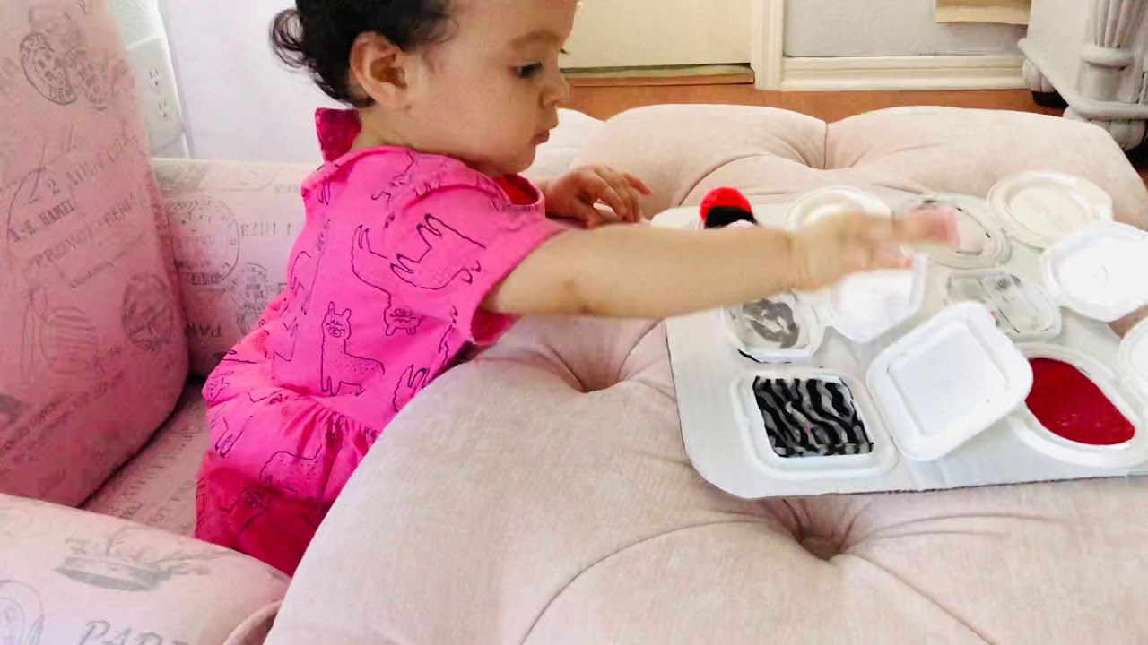 DIY Sensory Board Using Wipe Lids #babyactivities 