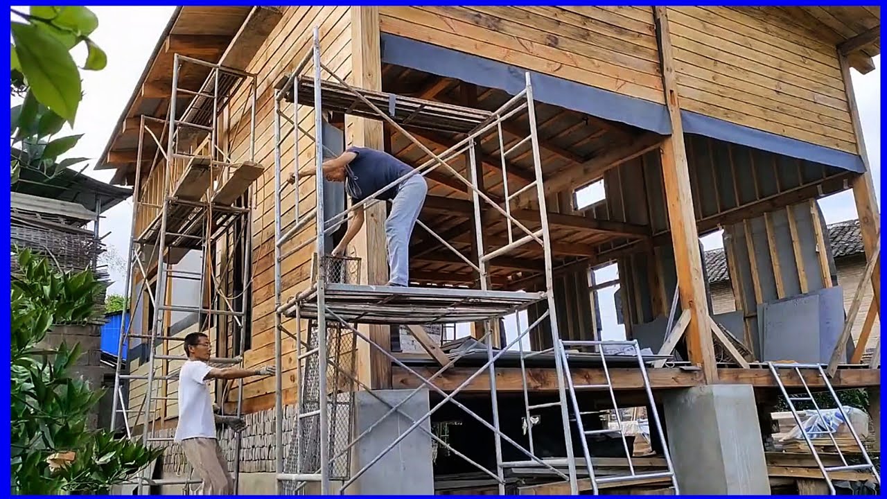 Skilled craftsmen build beautiful wooden houses in the countryside