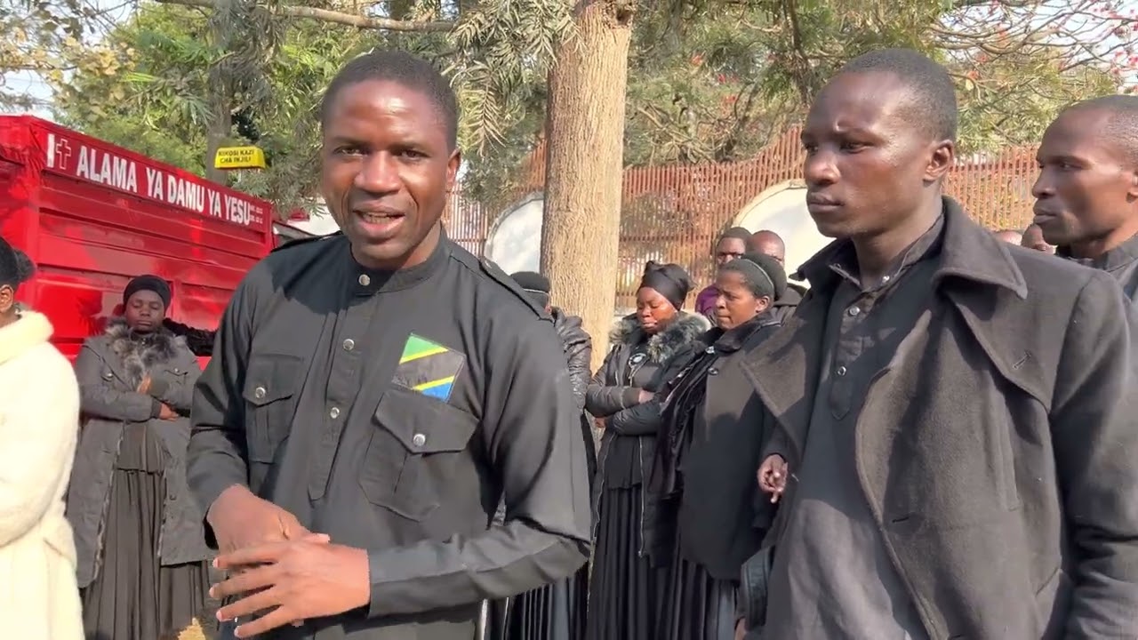 Pastor Mbarikiwa Mwakipesile, akiwa katika ofisi flani za serikali na kikozi cha INJILI.