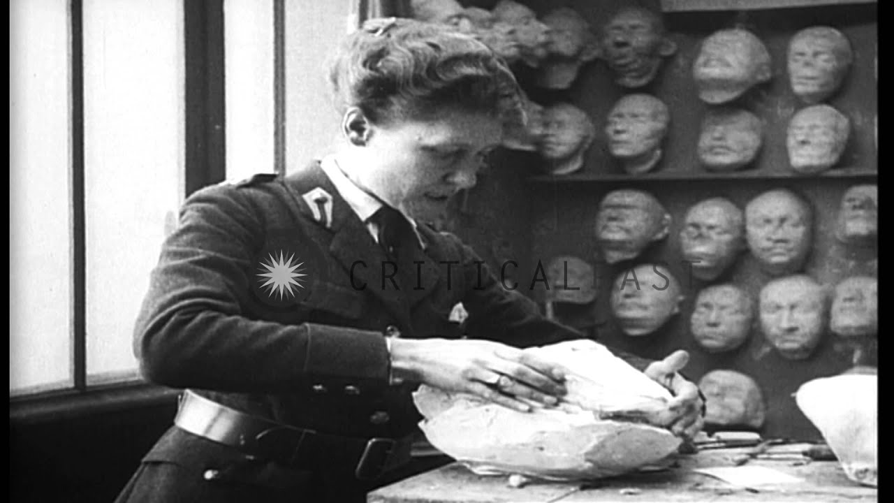 Red Cross workers making prosthetic masks for wounded American and French soldier...HD Stock Footage