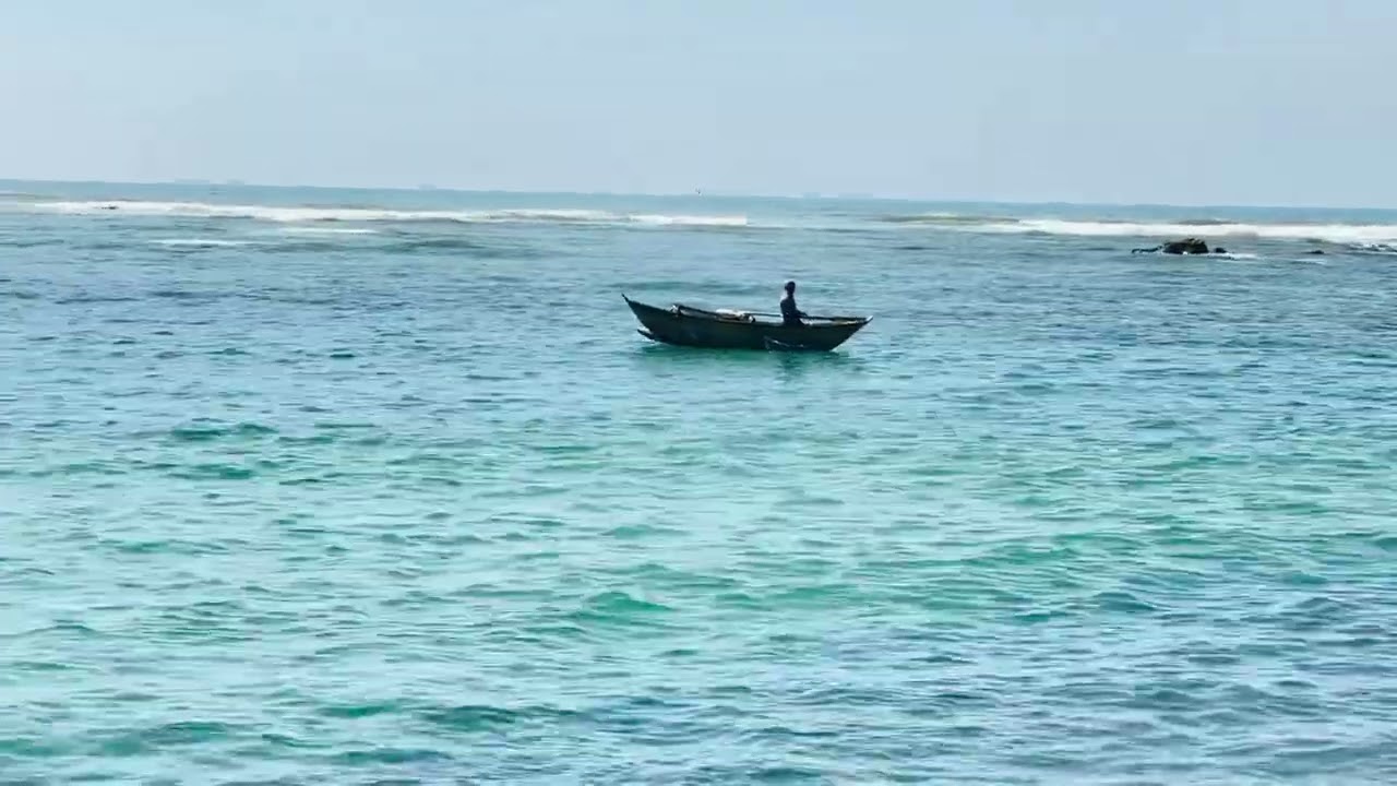 Traditional Fishermen Braving the Sea in a Classic Wooden Boat #fishing #sea
