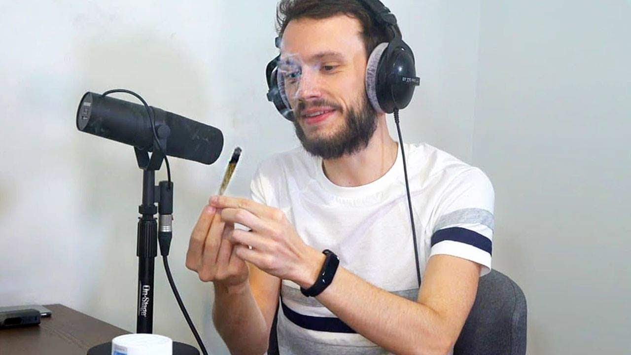 Laink smokes a joint with Nabil during the podcast