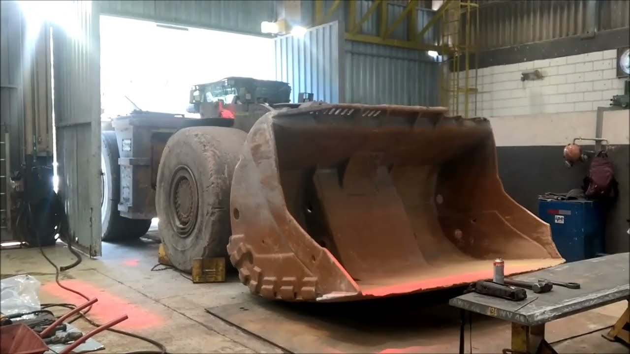 Line boring in holes of bucket the CAT R2900 LHD.