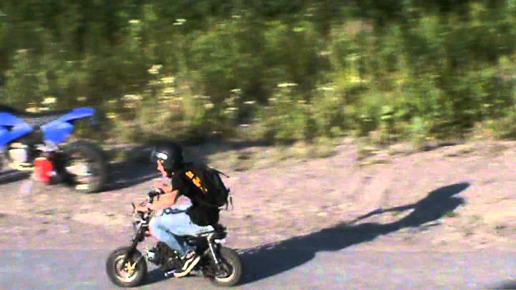 Bomber driving 110cc Honda Monkey