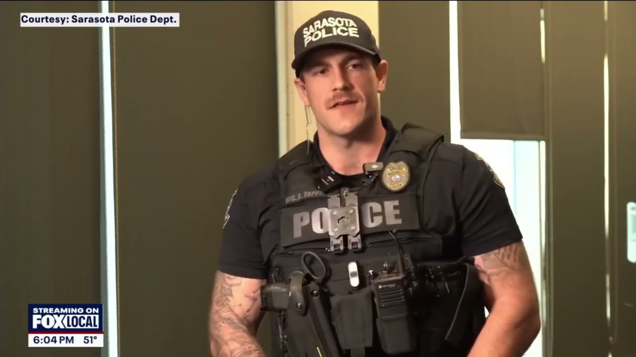 WTVT Fox 13: Sarasota police officers make daring rescue after running inside burning home