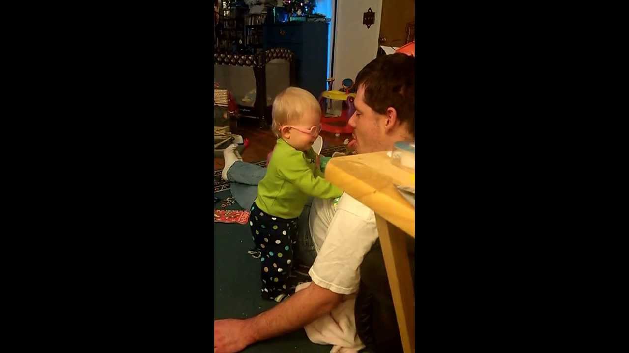 Daddy sticks his tongue out at Aly
