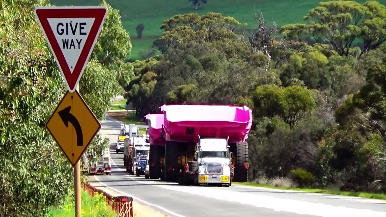 🚛. K & S Heavy Haulage with two Mack Titans. Hauling two fully dressed CAT 789D Mining dump trucks.