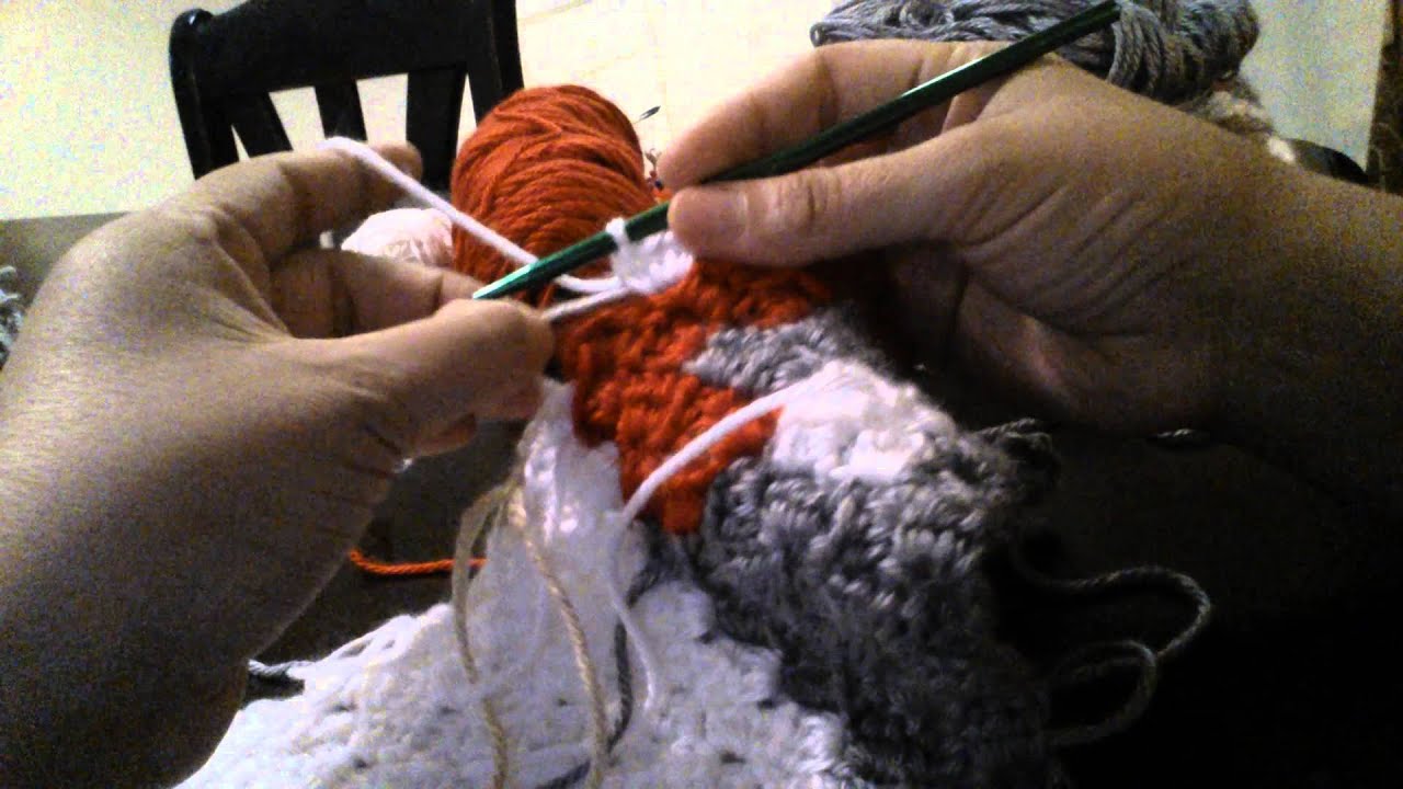 How to carry yarn when crocheting a c2c