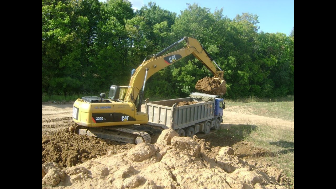 Cat 320D L loading Scania P380 and Volvo A30E