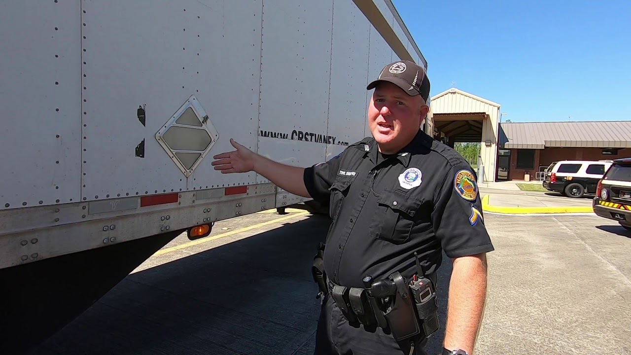 Florida Highway Patrol truck light and reflector inspection at Sneads weigh station on Interstate 10