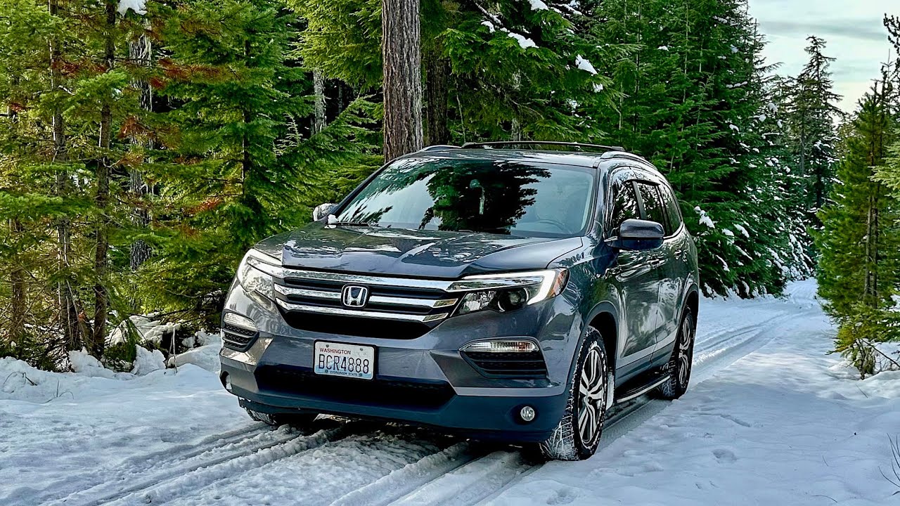 Honda Pilot EXL on icy mountain roads with half worn all-seasons tires