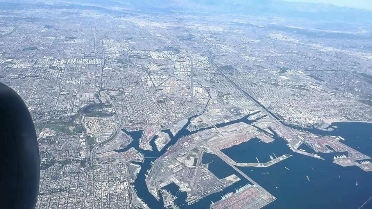 Takeoff from LAX with beautiful view over the city, towards Palos Verdes and Long Beach