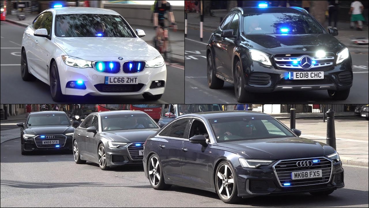Big video of unmarked police cars and emergency vehicles responding with siren and lights