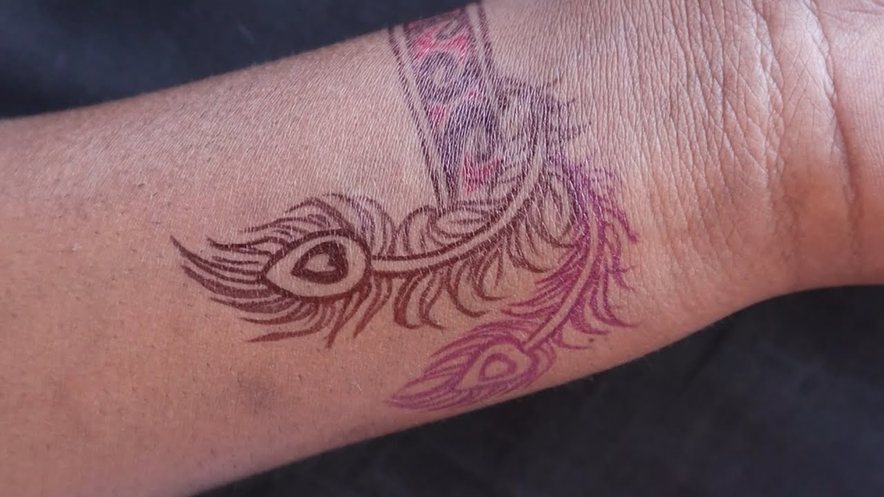 new simple band and feather tattoo design with pen