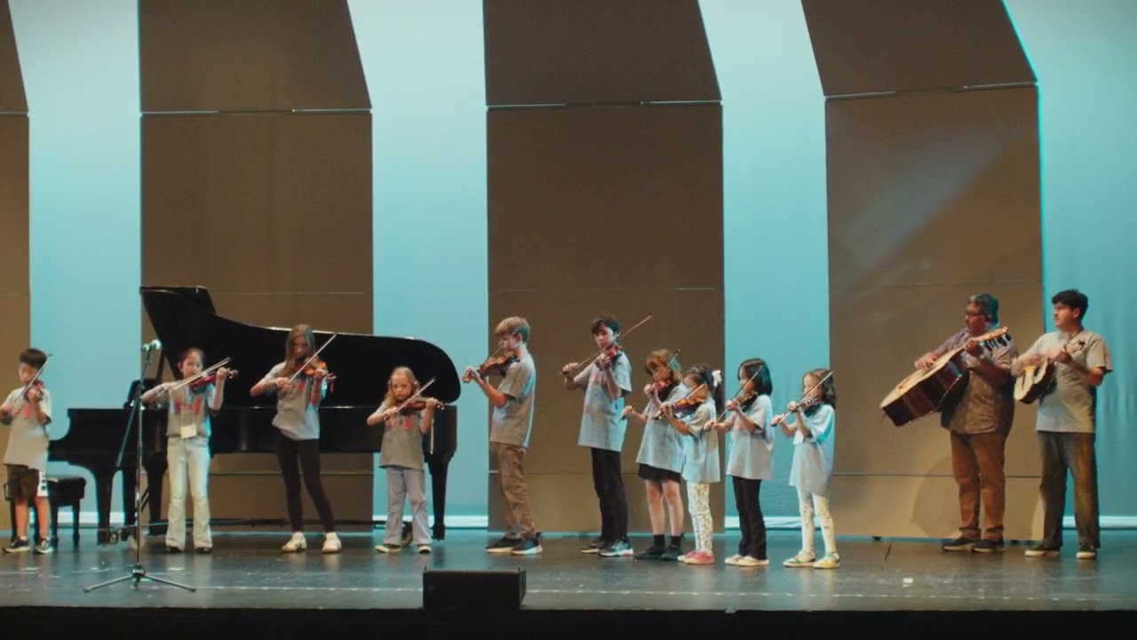 Young students performing a mariachi song 2025