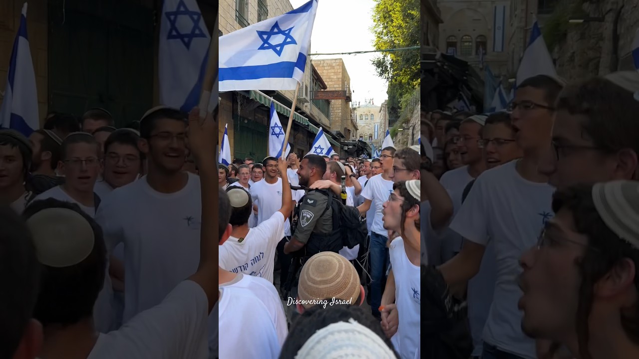 Group of Jews dancing with Israeli flags in the Muslim Quarter in Jerusalem, Israel 2024
