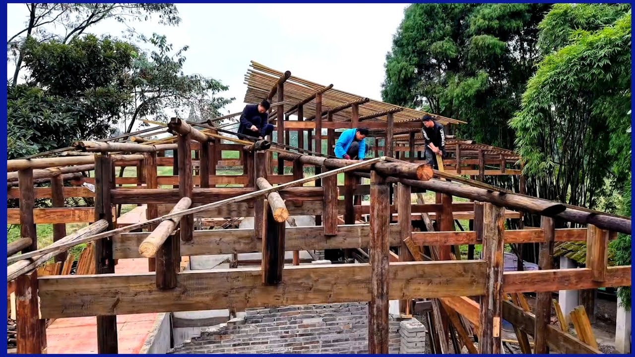 Skilled workers renovated a wooden house abandoned for many years in the countryside.