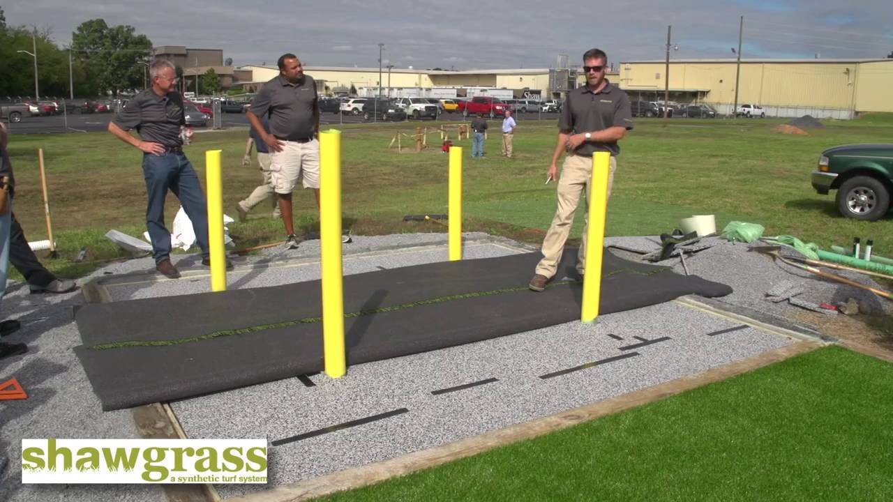 Shawgrass Installing Turf Around Playground Obstacles
