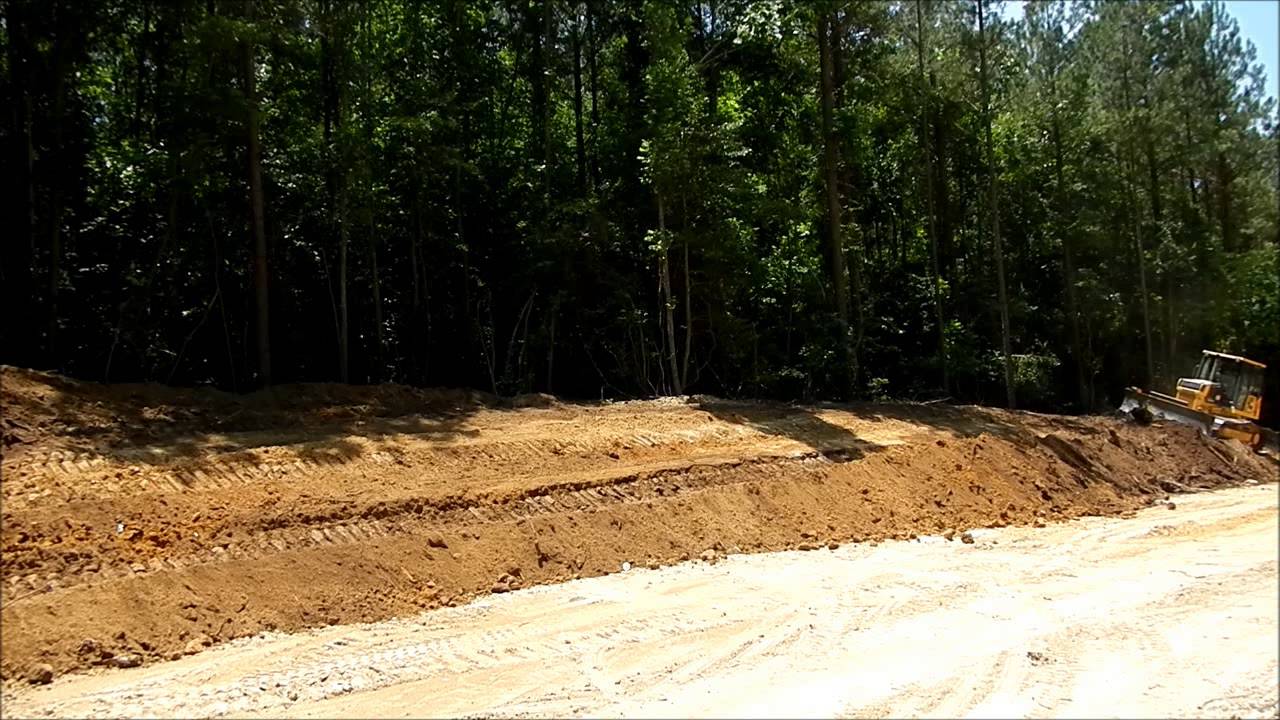 Dozer Cutting Down Slope