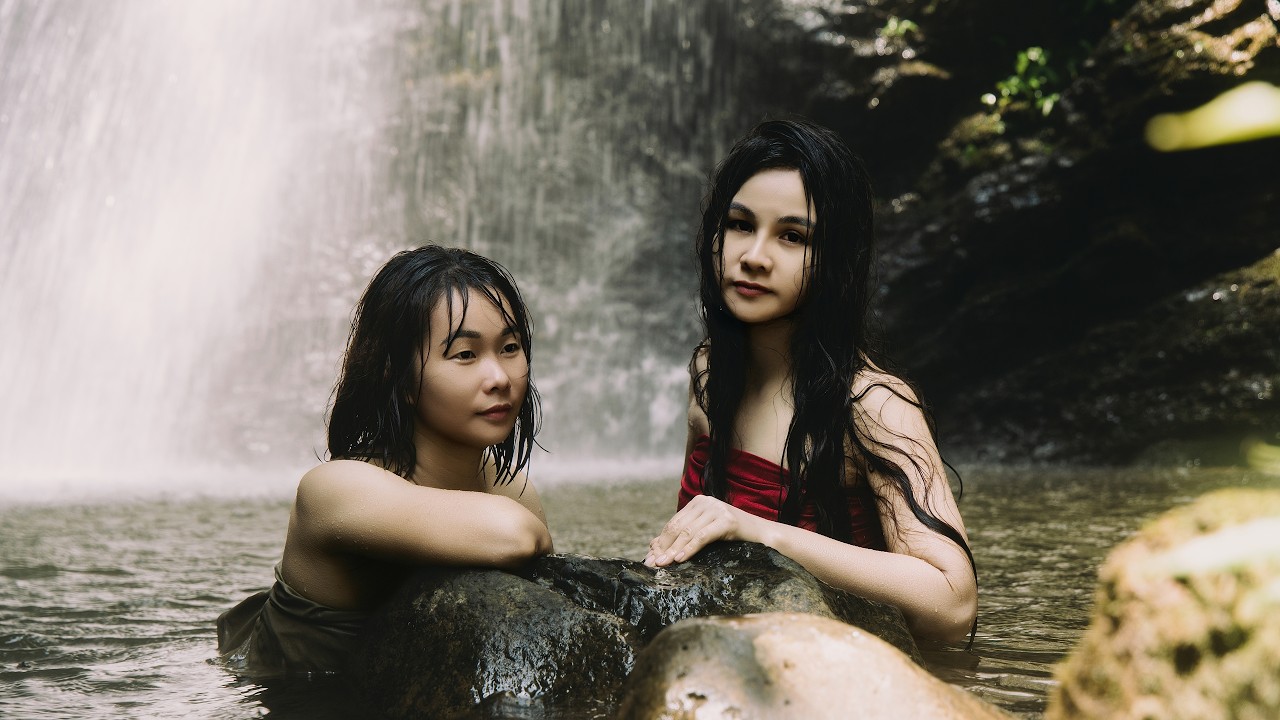 Harvesting in nature: picking wild berries in the forest and soaking in the cool water.
