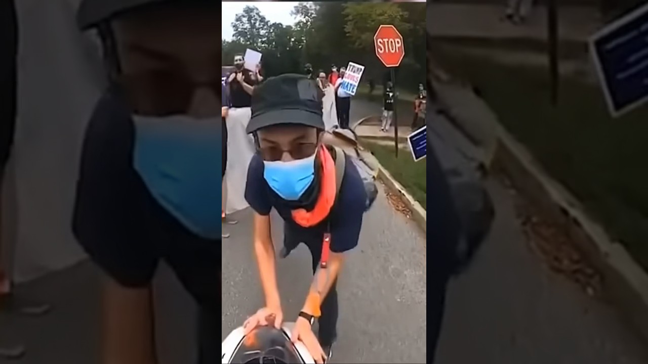 Man tries to get through a protest but revs at civilians #funny #road #protest #rev #bike #motorbike