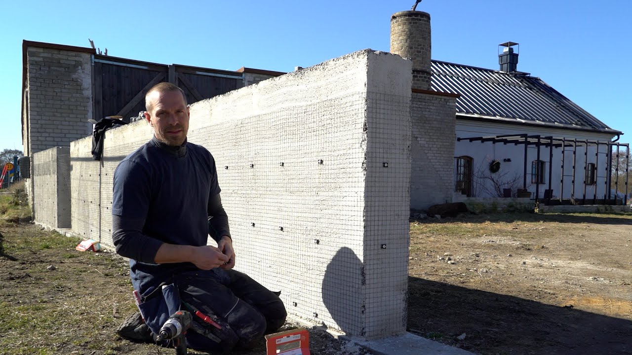 #65 Nätning av mur och putsning av gesims på garaget.
